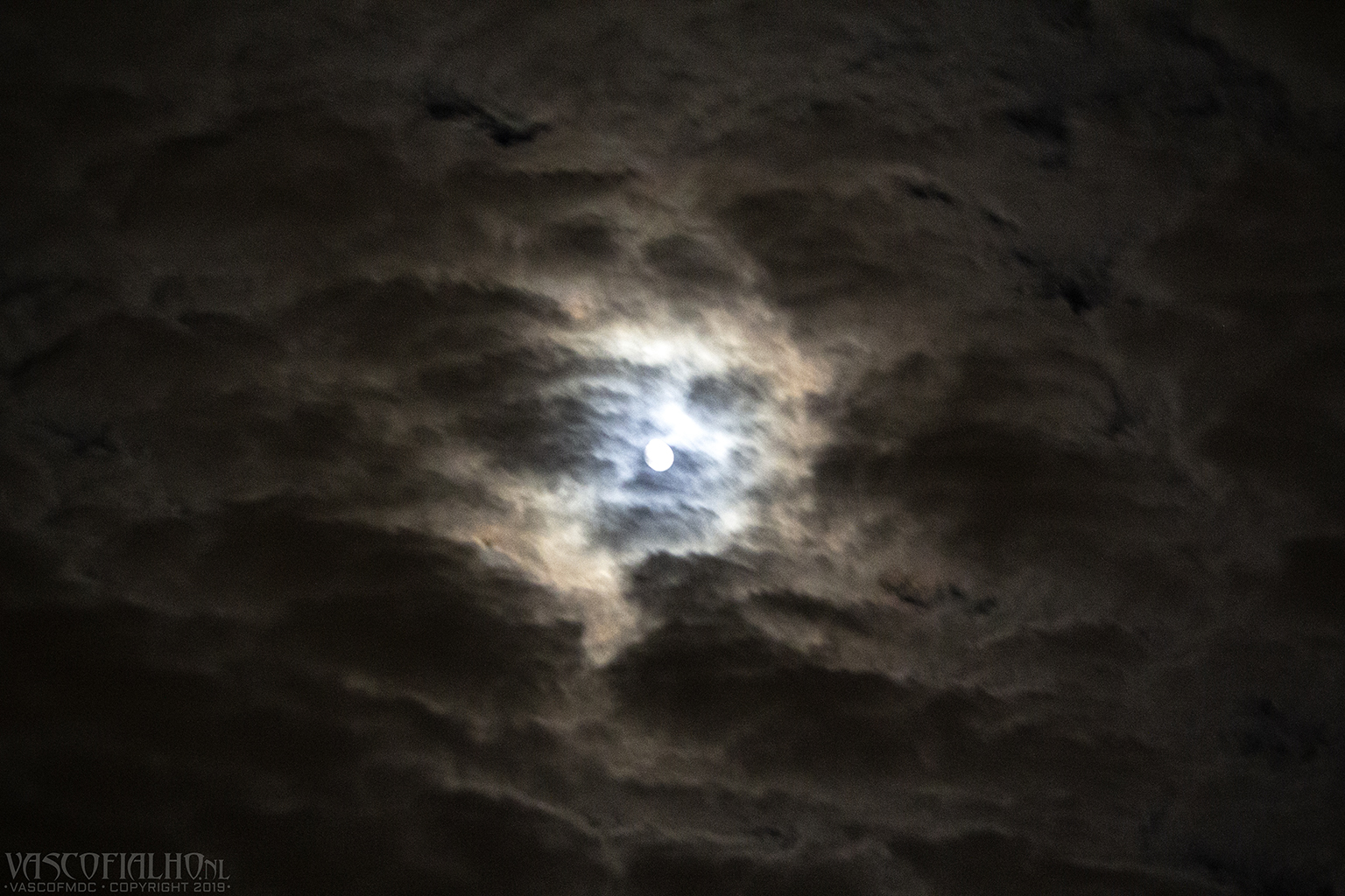 Cloudy moon over the city